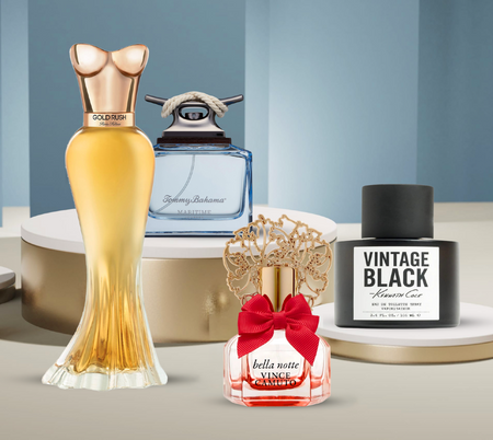 Assorted fragrance bottles displayed on white pedestals, including Gold Rush, Maritime, Bella Notte, and Vintage Black.