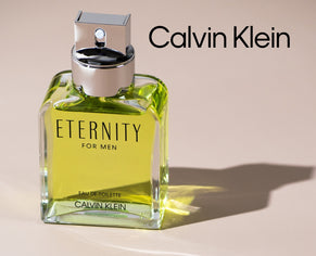 Calvin Klein Eternity for Men fragrance bottle with brand logo on a beige background.