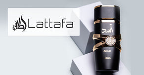Lattafa Asad perfume bottle in black and gold displayed on geometric blocks with the Lattafa brand logo on the left.