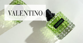 Valentino green studded perfume bottle with brand logo overlay on a light background.