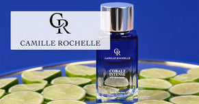 Camille Rochelle Cobalt Intense perfume bottle displayed on a bed of lime slices with a bold blue background.