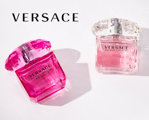 Two elegant Versace Bright Crystal perfume bottles, one in vibrant pink and the other in soft pink, displayed against a white background with the Versace logo above. Their faceted caps reflect light, adding a luxurious touch.